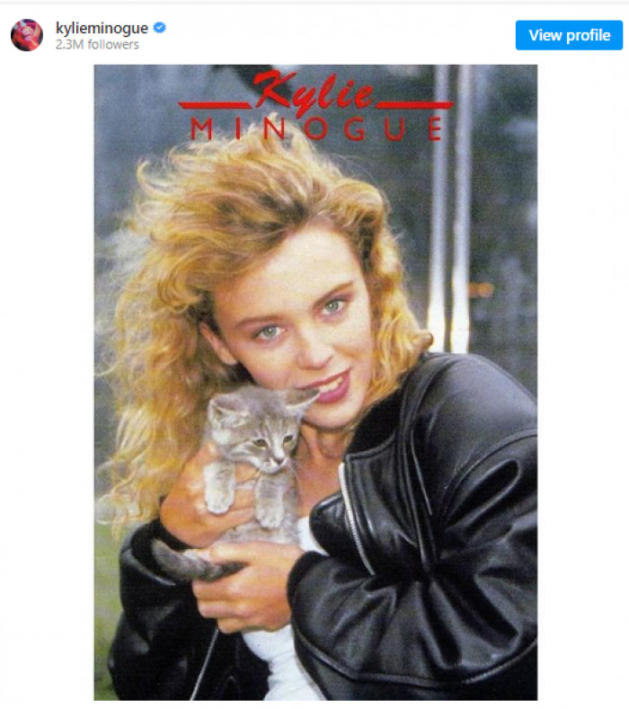 8. Kylie Minogue shared this adorable vintage photo of herself and a kitten on Instagram: