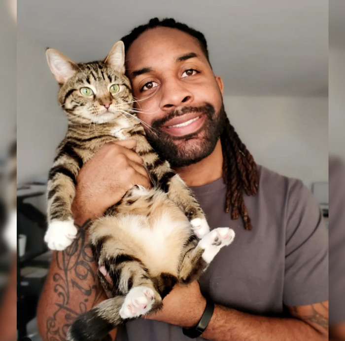 This is Abdul Williams and his sweet adopted cat, Bambi
