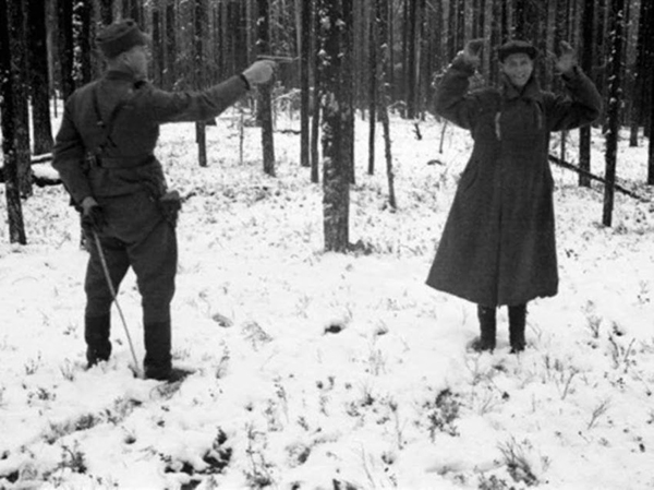 3. A Russian spy laughing through his own execution in Finland during the Winter War in 1939.