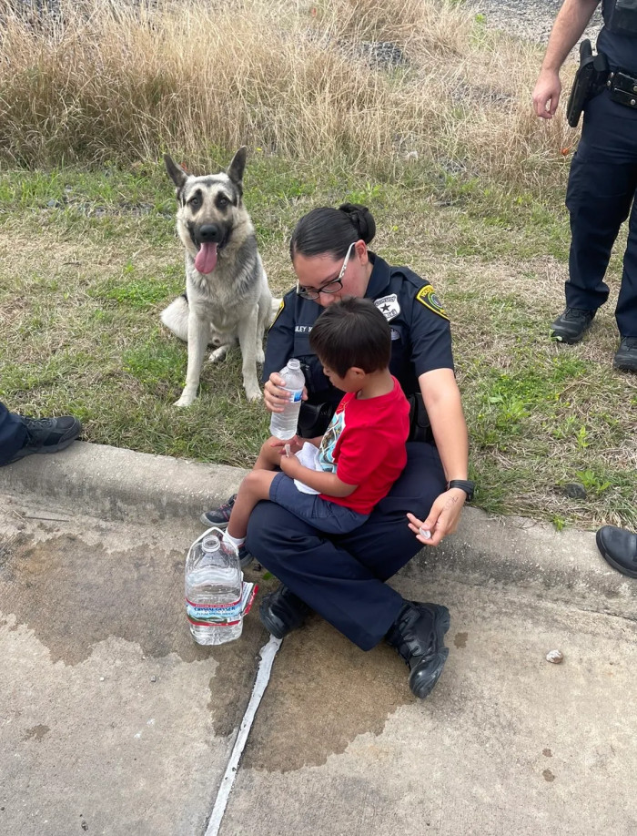 Here's an image of the little boy and the protective and amazing dog that kept him safe during his journey.