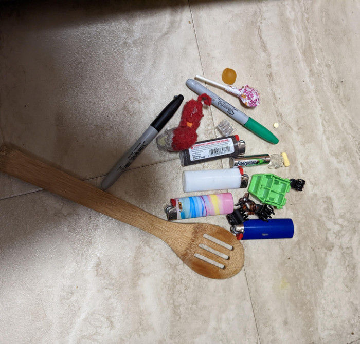 1. Ever wondered where some of your missing stuff goes? The owner of this cat called "Dot" just found their "hidey holes" under an oven!