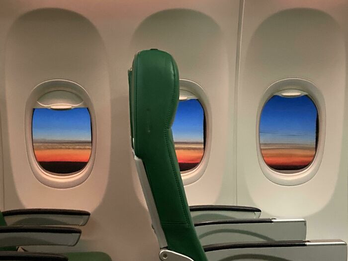 45. ITAP Of The Sunset Inside An Almost Empty Plane