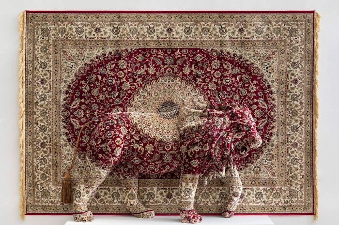 Wild dog sundown sculpture, animal figure appearing to escape from woven carpet