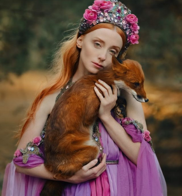 The photographer enjoys complex, elaborate images, beautiful dresses and accessories, and shooting with animals