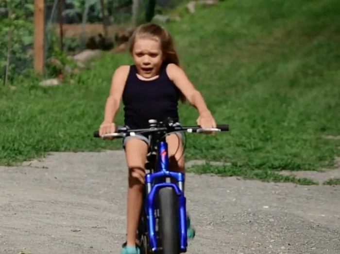 Bella riding her bike
