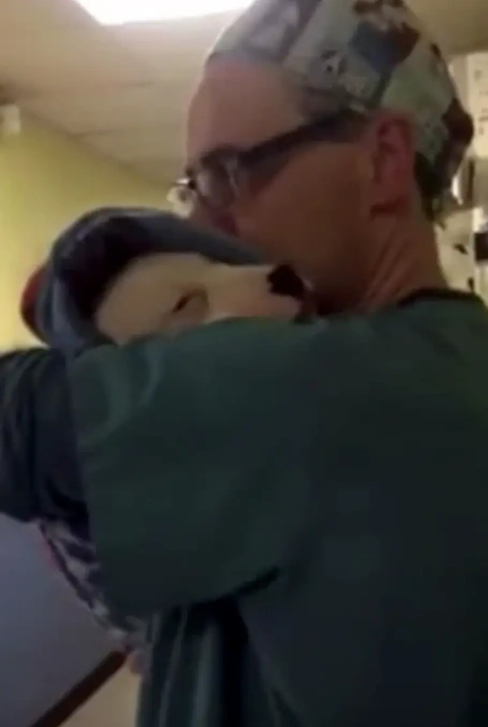 He cradled the poor puppy and made her feel better