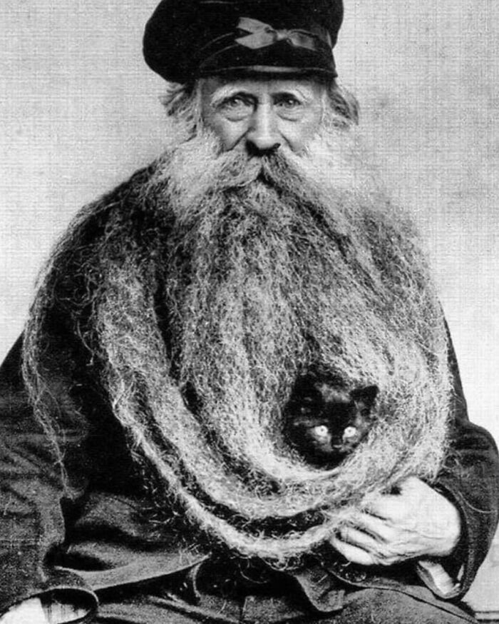 "Back in 1904, Louis Coulon made headlines with his extraordinary 11-foot-long beard (3.35 meters), which he even used as a cozy resting spot for his beloved cats."