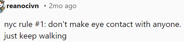 OP should avoid eye contact and keep moving.