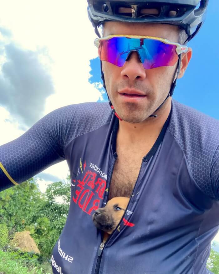 Silva spotted five tiny puppies in a deep hole struggling to survive. Silva and his companion rode the puppies 12 miles to safety with the puppies tucked in their shirts.