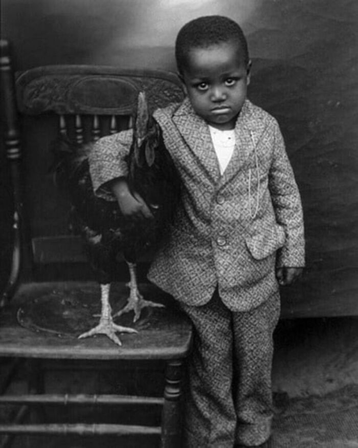 "A boy and his rooster, Columbia, South Carolina, early 1920s."