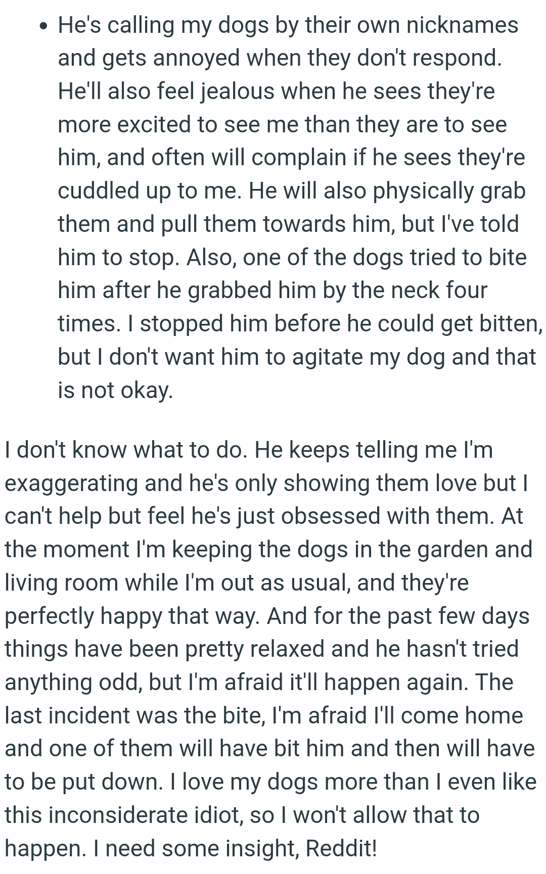 One of the dogs tried to bite him after he grabbed it by the neck