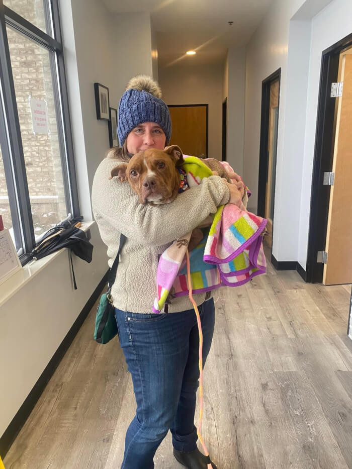 Patty posing with Emmy, the rescued senior dog