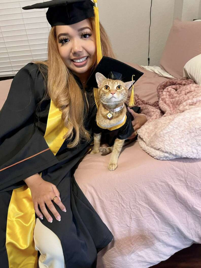 She made a tiny, Suki-sized cap and gown to perfectly match her own