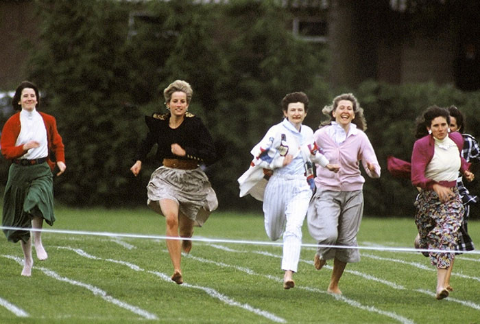 31. Princess Diana running in a competition for mothers at William's school in 1991